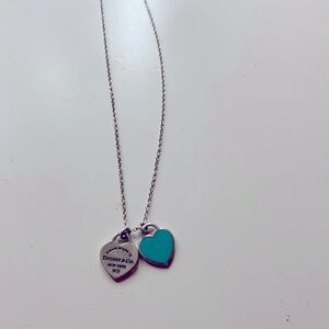 A silver Tiffany and co heart pendant necklace almost brand new and in good use